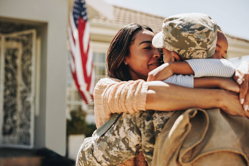 Military family saying goodbye as a soldier departs for deployment